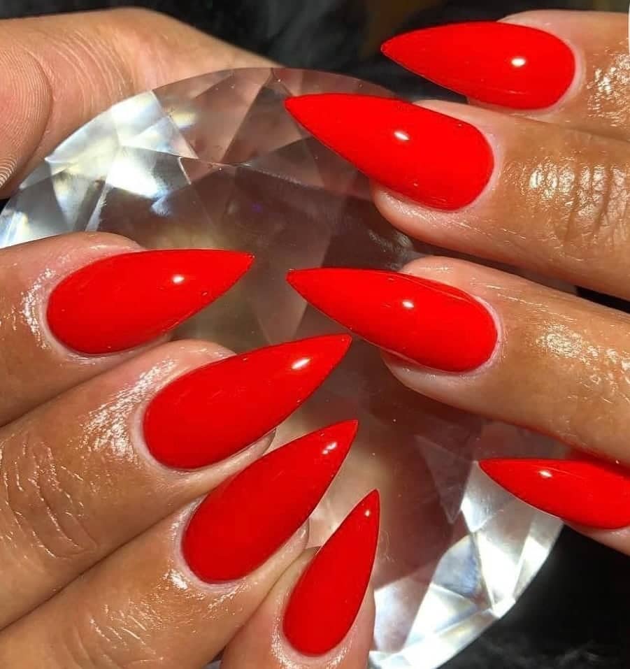 Glossy red stiletto nails