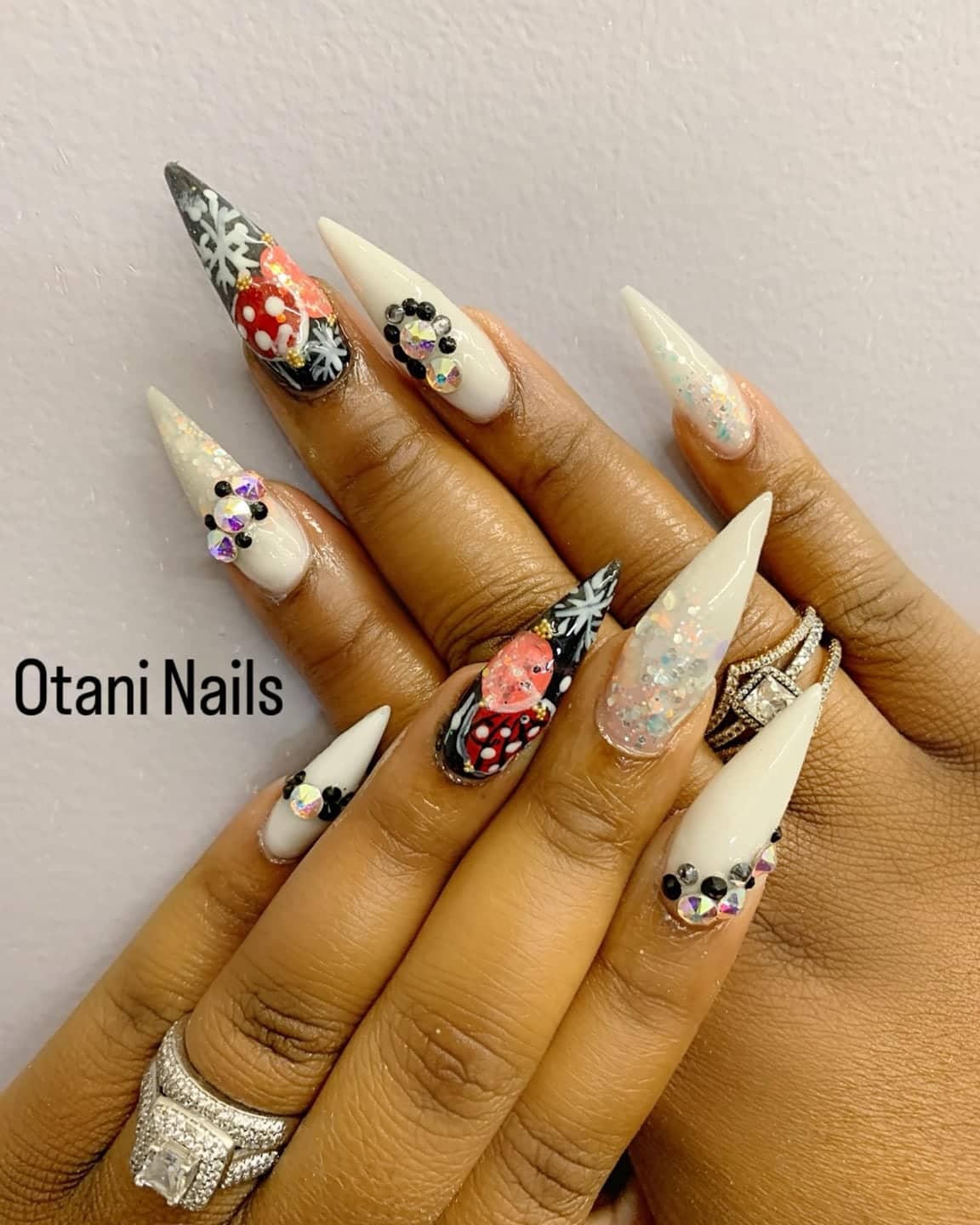 White stiletto nails with black-and-white art