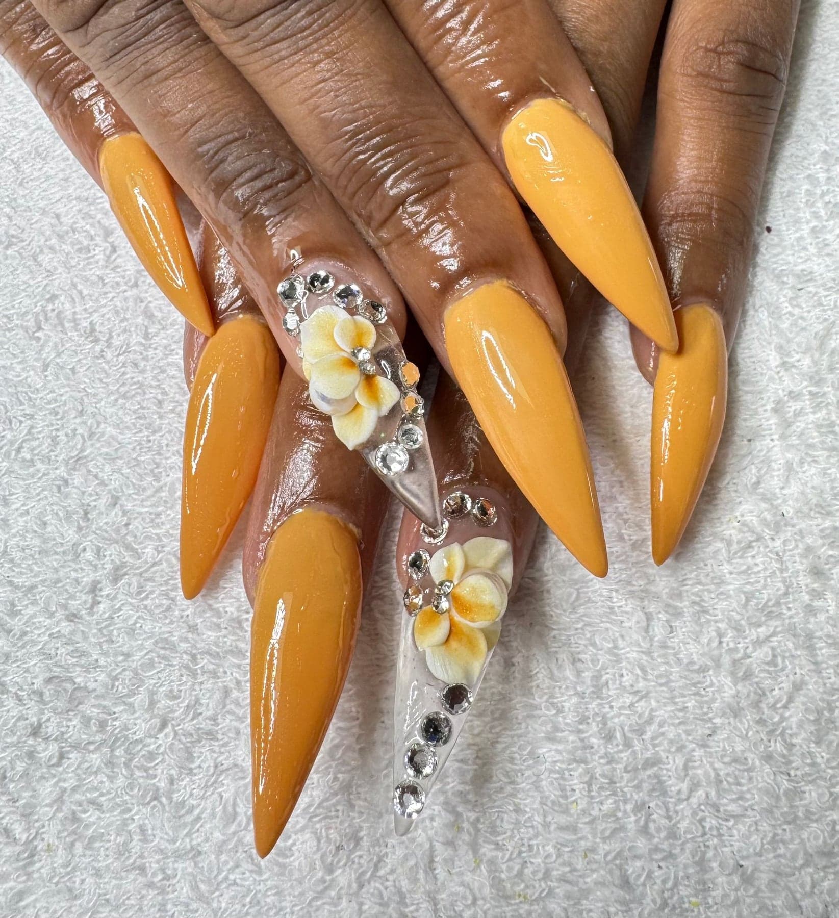 Amber stiletto nails with 3D flowers and crystals, by Otani